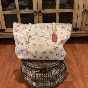 A Coach cherry zip tote.